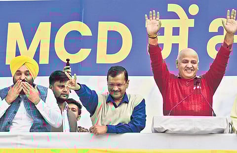 CM Arvind Kejriwal with Punjab CM Bhagwant Mann and Deputy CM Manish Sisodia during celebrations after AAP crossed the majority mark in MCD polls on Wednesday