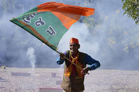Bharatiya Janata Party (BJP) supporters celebrate in Gujarat's Gandhinagar. (Photo | AP)