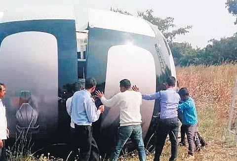 Residents of Mogiligidda in Marpally mandal and government officials at the site in the village where a space capsule launched by TIFR carrying a payload to study the stratosphere landed on Wednesday.