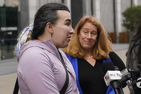 Former Twitter employee Wren Turkal, left, speaks next to attorney Shannon Liss-Riordan during a news conference outside of a federal courthouse in San Francisco. (Photo | AP)
