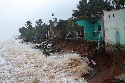 Fifteen houses on the coast at Pillaichavady collapsed as high tides under the impact of cyclone Mandous eroded the coast on Friday. (Photo | R Sriram, EPS)