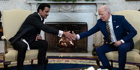 Qatar's Emir Sheikh Tamim bin Hamad Al Than (L) shakes hand with US President Joe Biden. (Photo| AP)