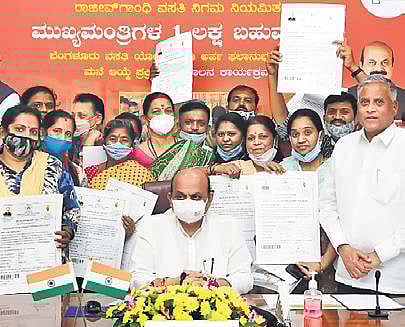 Bommai hands over site deeds to poor, cheques to kin of Covid victims