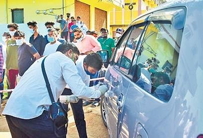 Forensic experts collect fingerprints from the car at Siddipet Sub-registrar’s Office on Monday. (File photo)