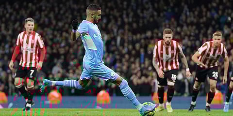 Manchester City's Riyad Mahrez scores a goal during an EPL match against Brentford. (Photo| AP)