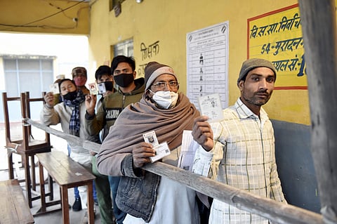 People at a polling station to cast their votes during the voting for the first phase of Uttar Pradesh elections at Muradnagar, Uttar Pradesh,Thursday, Feb. 10, 2022. (PTI)
