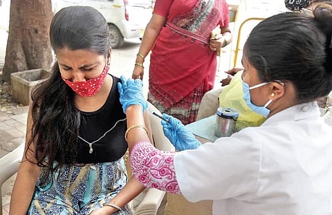 A girl being administered the Covid-19 vaccine | Express