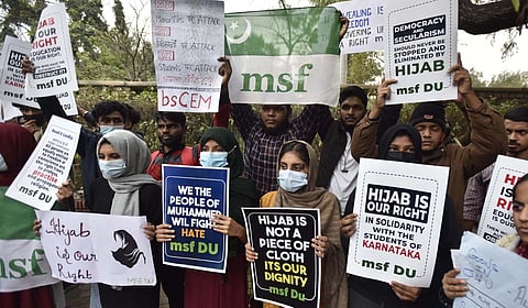 Delhi University Muslim Students Federation activists hold placards during a protest over the hijab controversy in Karnataka, outside Arts Faculty in New Delhi. (Photo | Shekhar Yadav, EPS)