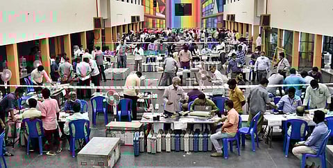 Workers prepare EVMs for the polls, at Korattur, in Chennai on Saturday | P Jawahar