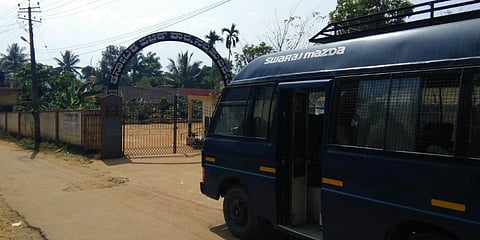 Police vehicle parked outside the gate of Karnataka Public School in Kodagu's Nellihudikeri, Feb 14, 2022. (Photo | EPS)