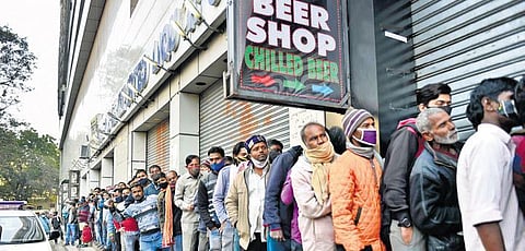 People stand in a queue outside a liquor shop | Shekhar Yadav