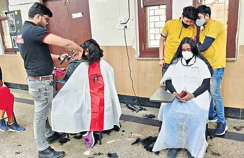 Stylists cut hair of nurses to make wigs for cancer patients (Photo | Express)
