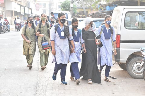 Students at Women’s Government PU College, Udupi, arriving as classes reopened on Wednesday (Photo | Express)