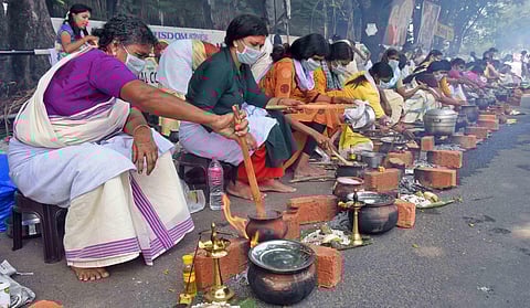 Devotees wearing masks particpate in the famed Attukal Pongala festival in Thiruvananthapuram. (File Photo | BP Deepu, EPS)