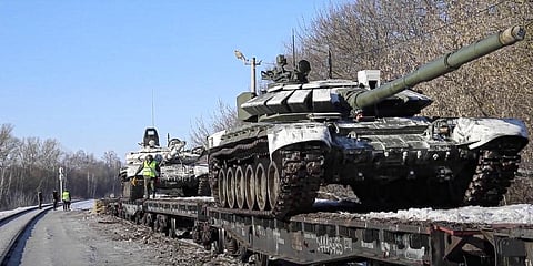 Russian army tanks are loaded onto railway platforms to move back to their permanent base after drills in Russia. Russia says it is returning more troops and weapons to bases.(Photo | AP)