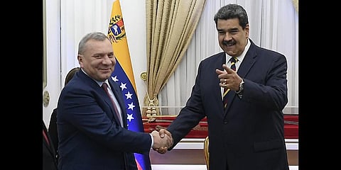 Russia's Deputy Prime Minister Yuri Borisov, left, and Venezuela's President Maduro, shake hands during a media presentation at the Presidential Palace in Venezuela,  Feb. 16, 2022.(Photo | AP)