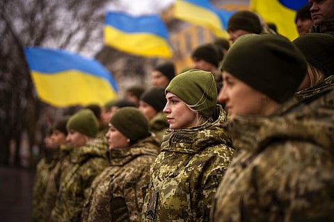 Ukrainian Army soldiers pose for a photo as they gather to celebrate a Day of Unity in Odessa, Ukraine, Wednesday, Feb. 16, 2022. (Photo | AP)