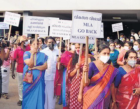 Twenty20 workers protesting in front of the mortuary of Rajagiri Hospital in Kochi on Friday while waiting to receive the body of slain worker Deepu C K