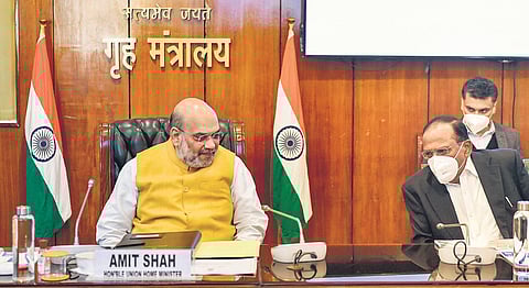 Union home minister Amit Shah speaks with NSA Ajit Doval during the review meeting on Friday. (Photo | PTI)