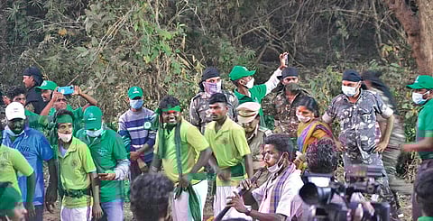 Joyful tribal youth perform a dance to a folklore ahead of the arrival of deity Samakka at Medaram on Friday