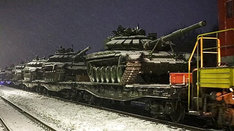 Russian army tanks are loaded onto railway platforms to move back to their permanent base after drills in Russia. (Photo | AP)