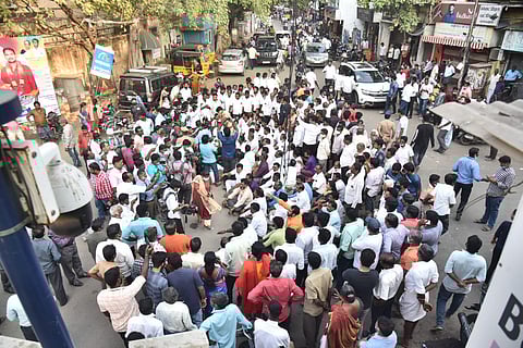 AIADMK partymen led by former Minister D Jayakumar block the GA Road, demanding arrest of DMK men for allegedly booth capturing. (Express / P Jawahar)