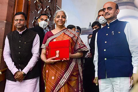 Union Minister of Finance Nirmala Sitharaman with Ministers of State for Finance Bhagwat Kishanrao Karad and Pankaj Chaudhary on  Budget day. (Photo | PTI)