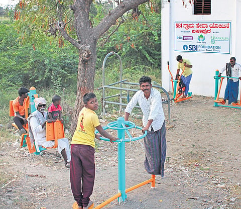 Residents of Basapur village  in Gadag district use  the open-air gym  | EXPRESS