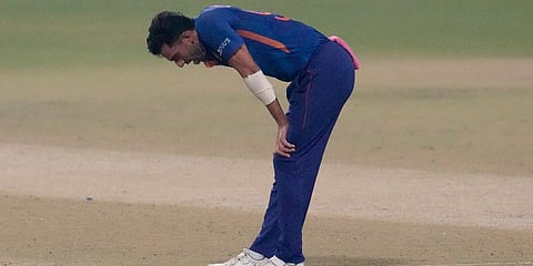 India's Deepak Chahar reacts in pain after bowling a delivery during their third Twenty20 International match against West Indies in Kolkata, India, Feb. 20, 2022. (Photo | AP)