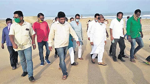 Water Resources Minister Raghunandan Das during his visit to Dhinkia village. (Photo | EPS)