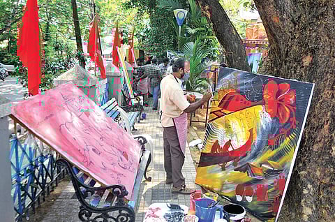 Artists take part in Red Palette, the painting camp organised ahead of the CPM state conference, at Vylopilly Park in Kochi on Sunday. Around 60 artists participated in the event (Photo|EPS, A Sanesh)