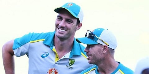 Australian batter David Warner (R) and pacer Pat Cummins (File photo| AFP)