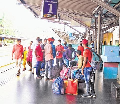 Migrant workers waiting for a train to Delhi at North Railway Station in Kochi | A Sanesh