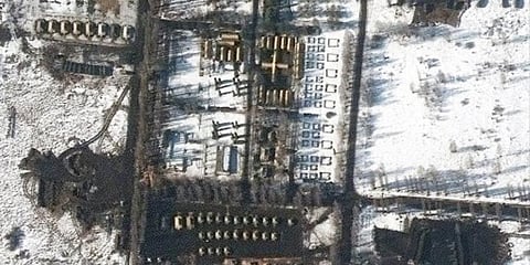 The new photos, taken Sunday, appear to show vehicle tracks cutting through snow-covered fields. (Photo | AFP)