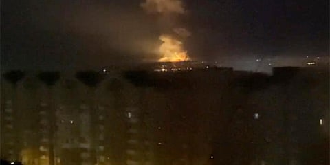 A flame is seen from an area near the Dnieper river in Kyiv, Ukraine. (Photo| AP)