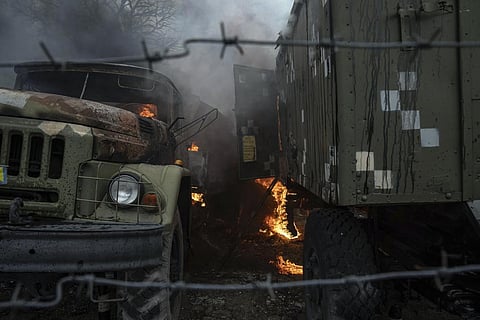 Ukrainian military track burns at an air defence base in the aftermath of an apparent Russian strike in Mariupol, Ukraine, Thursday, Feb. 24, 2022.  (Photo | AP)