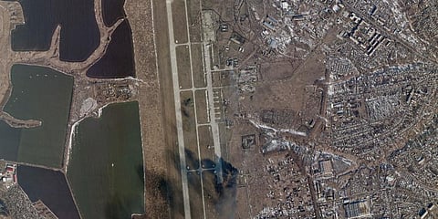 A satellite image showing smoke rising from the Chuhuiv Airbase outside of Kharkiv, Ukraine. (Photo | AP)