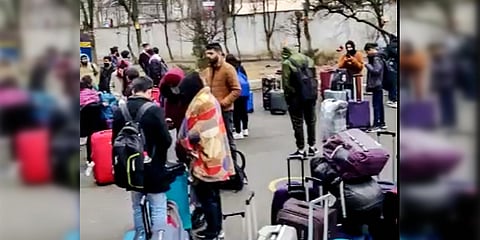 Indian nationals wait for rescue and relief operations amid Russia's military operation outside the Embassy of India, in Kyiv. (Photo| PTI)