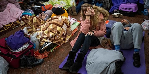 People rest in the Kyiv subway, using it as a bomb shelter in Kyiv, Ukraine. (Photo | AP)