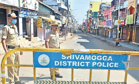 Police barricade a road in Shivamogga, which is under curfew following the killing of Bajrang Dal activist Harsha, on Friday. (Photo | EPS)