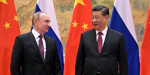 FILE - Chinese President Xi Jinping, right, and Russian President Vladimir Putin talk to each other during their meeting in Beijing, Feb. 4, 2022. (Photo | AP)