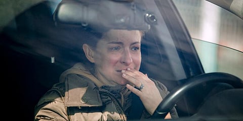 A woman weeps in her car after crossing the border from Ukraine at the Romanian-Ukrainian border, in Sighetu Marmatiei, Romania, Friday, Feb. 25, 2022. (Photo | AP)