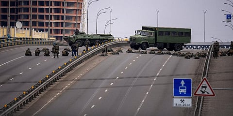 Ukrainian soldiers take position on a bridge inside the city of Kyiv, Ukraine, Friday, Feb. 25, 2022. (Photo | AFP)