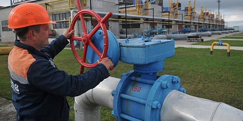 A worker at a Ukrainian gas station in Volovets, western Ukraine. (Photo | AP)