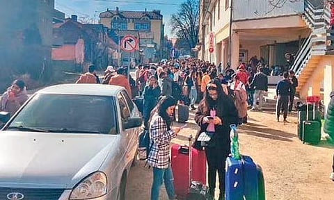 Priya (wearing headband) from Davanagere, along with other Indian students, waits to board a bus from Chernivtsi in Ukraine to reach Romania from where they will be brought to India by a special fligt