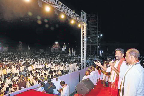 Revanth Reddy speaks at the public meeting in Parigi, where he demanded support for all paddy farmers, on Saturday. (Photo | EPS)