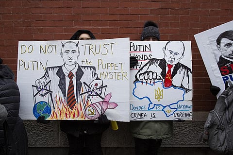 Demonstrators protest in support of Ukraine, in Times Square New York, on February 24, 2022. (Photo | AFP)