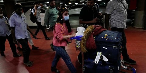 An Indian student who was part of a batch of 250 Indian nationals evacuated from Ukraine leaves Chhatrapati Shivaji Maharaj International Airport in Mumbai. (Photo | AP)