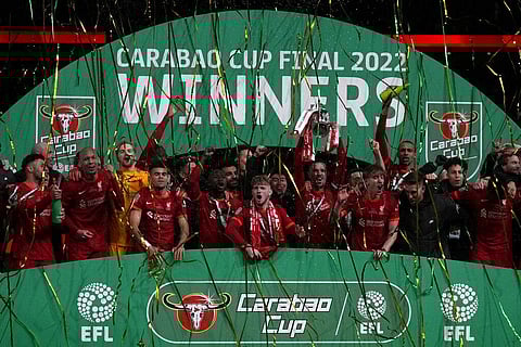 Liverpool players celebrate with the trophy after winning the English League Cup final soccer match between Chelsea and Liverpool at Wembley stadium in London(Photo | AP)