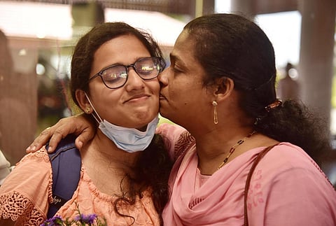 Greeshma Thomas Anchery is happy to reunite with her family at Kochi airport. (Photo | Albin Mathew, EPS)